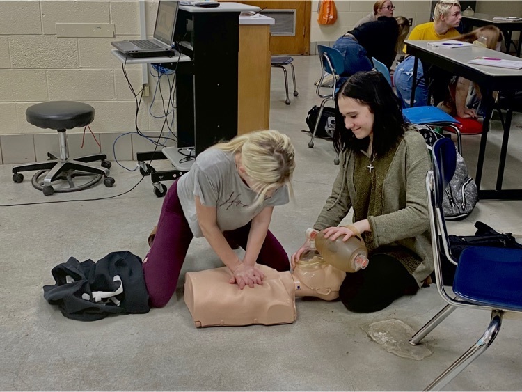 students performing CPR