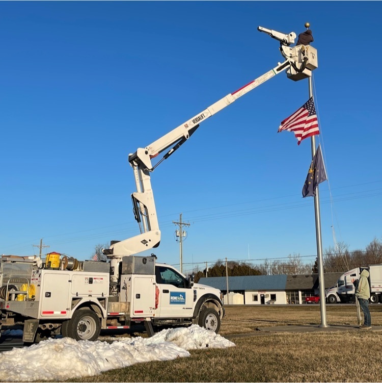 REMC’s bucket truck helping Maintenance fix our flag pole. 